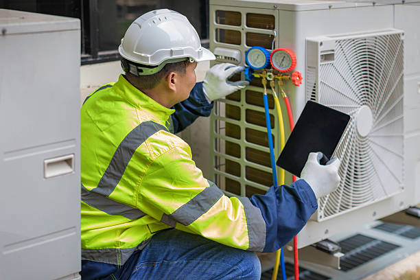 Professional Hvac technician working in Fayville, MA